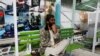 A Taliban fighter stands guard in an amusement park in Kabul, Afghanistan, Nov. 9, 2022. 