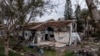 FILE - A battle-scarred home in Kibbutz Be'eri, an Israeli communal farm on the Gaza border, is seen on Jan. 11, 2024. Hamas held more than a dozen hostages in the home when it overran southern Israel on Oct. 7.