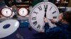 FILE - Ian Roders fastens the hands to a clock at Electric Time Company, Nov. 1, 2022, in Medfield, Massachusetts. President-elect Donald Trump has said he wants to eliminate daylight saving time.