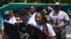 Legacy Garner, Eric Garner's youngest daughter, center, marches with family and supporters during an event to memorialize Eric Garner in the Staten Island borough of New York, July 17, 2024. 
