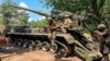 Russian soldiers operate 2S7M Malka self-propelled cannon in an undisclosed location, in this photo taken from video, July 23, 2024. (Russian Defense Ministry Press Service via AP)