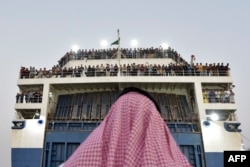 A boat with 1,687 civilians from more than 50 countries fleeing violence in Sudan, arrives at King Faisal navy base in Jeddah, Saudi Arabia, Apr. 26, 2023