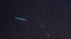 FILE - A meteor from the Geminids meteor shower enters Earth's atmosphere on Dec. 12, 2009, above Southold, N.Y. A meteor streaked across New York City's skyline and disintegrated over nearby New Jersey on July 16, 2024. 