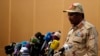 FILE - Gen. Mohamed Hamdan Dagalo, the deputy head of the military council speaks at a ceremony in Khartoum, Aug. 4, 2019. Sudan's paramilitary leader has announced plans to attend ceasefire talks in Switzerland arranged by the US and Saudi Arabia. 