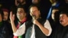 FILE - Pakistan's former Prime Minister Imran Khan, center, addresses during an anti-government rally in Islamabad, Pakistan, Aug. 20, 2022.