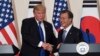 U.S. President Donald Trump, left, and South Korean President Moon Jae-In shake hands during a joint press conference at the presidential Blue House in Seoul, South Korea, Tuesday, Nov. 7, 2017. 