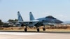 FILE - This Sept. 26, 2019, photo shows a Russian Su-35 fighter jet taking off at Hemeimeem air base in Syria.