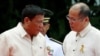 Incoming President Rodrigo Duterte (L) listens as outgoing President Benigno Aquino talks to him before Aquino leaves the Malacanang Palace in Manila, Philippines, June 30, 2016.