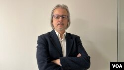 Prof. Îlhan Ûzgel,