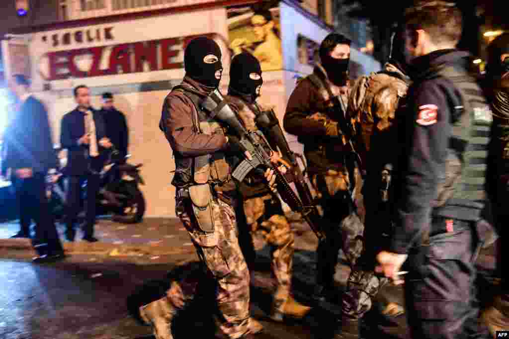 Turkish special force police officers patrol streets after a car bomb exploded near the stadium of football club Besiktas in Istanbul Dec. 10, 2016, killing at least 38 people and wounding around 20 police officers.