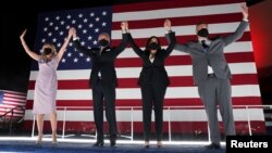 Democratic presidential candidate and former Vice President Joe Biden, his wife Jill Biden, U.S. Senator and Democratic candidate for Vice President Kamala Harris and her husband Douglas Emhoff celebrate after Joe Biden accepted the 2020 Democratic presidential nomination