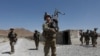 FILE - U.S. troops patrol at an Afghan National Army base in Logar province, Afghanistan Aug. 7, 2018.