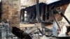 FILE - The remains of a house destroyed by bushfires are seen in the town of Kinglake, about 56km (35 miles) northeast of Melbourne, Feb. 16, 2009. Authorities said it would be weeks before they would be able to say that the fires are definitely out. 
