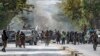 Taliban fighters stand guard at the site of an explosion, near a mosque, in Kabul, Afghanistan, Sept. 23, 2022. 