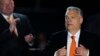 Hungary's Prime Minister Viktor Orban acknowledges cheering supporters during an election night rally in Budapest, Hungary, Sunday, April 3, 2022.