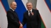 Rossiya Prezidenti Vladimir Putin (chapda) O'zbekiston rahbari Shavkat Mirziyoyev bilan, 2022-yil, 15-sentabr, Samarqand, O'zbekiston