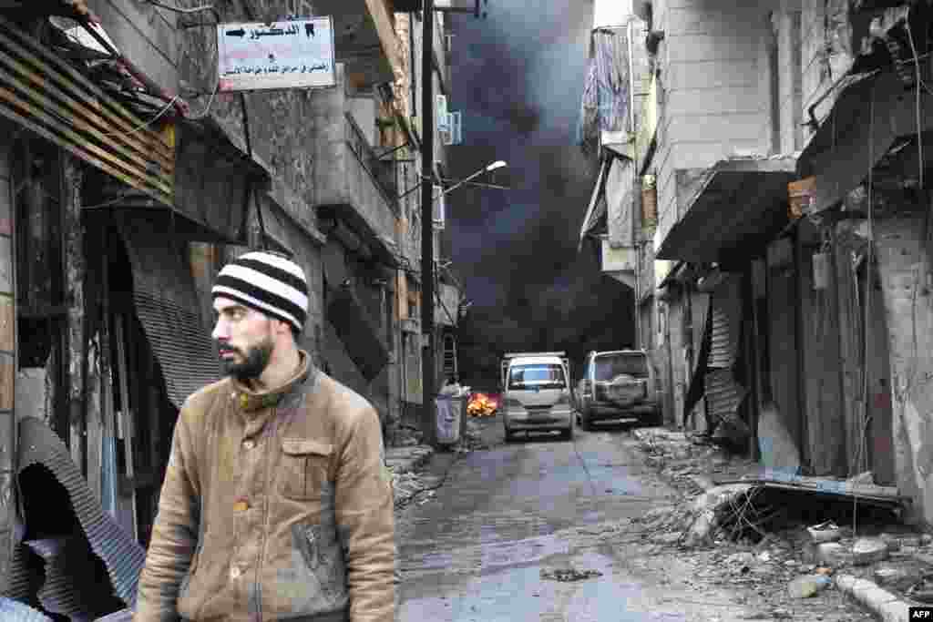 A Syrian man walks through the former rebel-held Salaheddin district in the northern Syrian city of Aleppo.