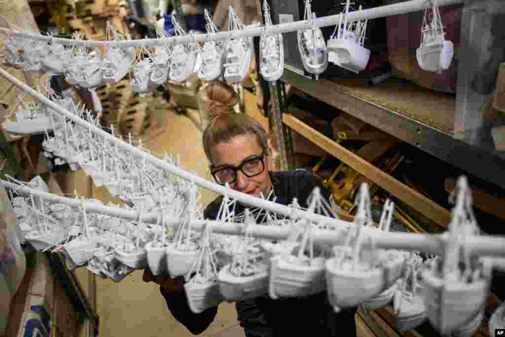 Designer Amanda Davis inspects parts of a &#39;Manchester by the Sea&#39;-themed table centerpiece that will be used for the British Academy Film Awards (BAFTA) ceremony dinner in London. The annual ceremony will be held on Sunday.