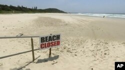 This Nov. 7, 2018, image made from video shows the beach where a shark attack occurred in Ballina, Australia. 