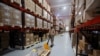 FILE - An employee works inside the warehouse of Alembic Pharmaceutical Limited's plant in Halol, in the western state of Gujarat, India, July 14, 2017. 