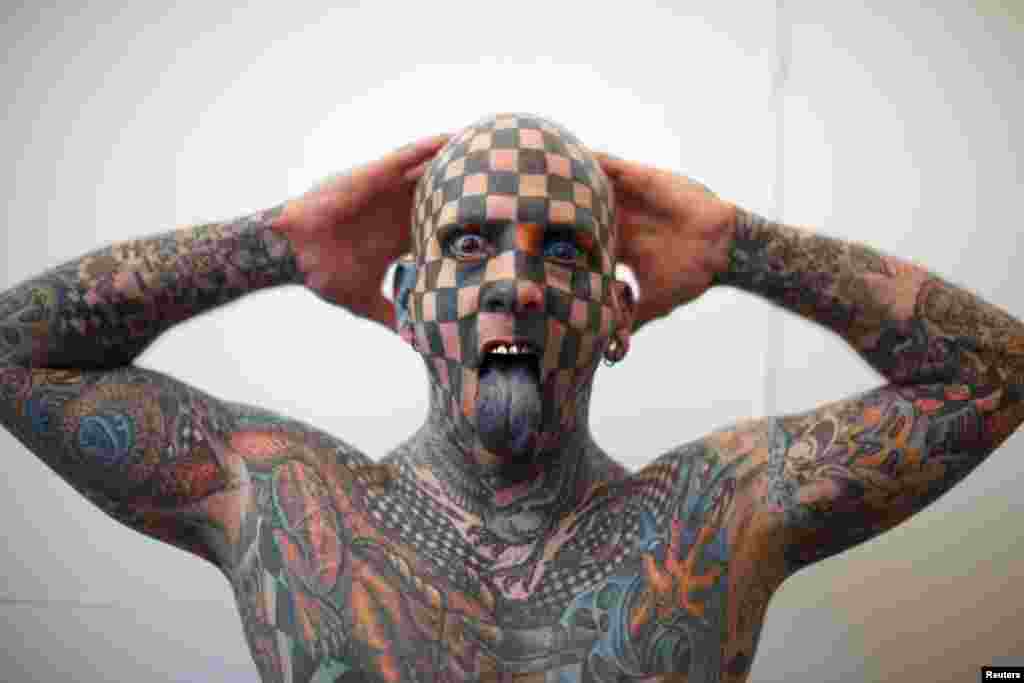 Matt Gone, the 'Checkered Man,' poses during the Venezuela Expo Tattoo in Caracas.