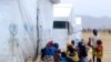 FILE - Nigerian refugees sit by a UNHCR tent in the refugee camp of Minawao, on the border of Nigeria at the extreme north of Cameroon, March 29, 2014. 