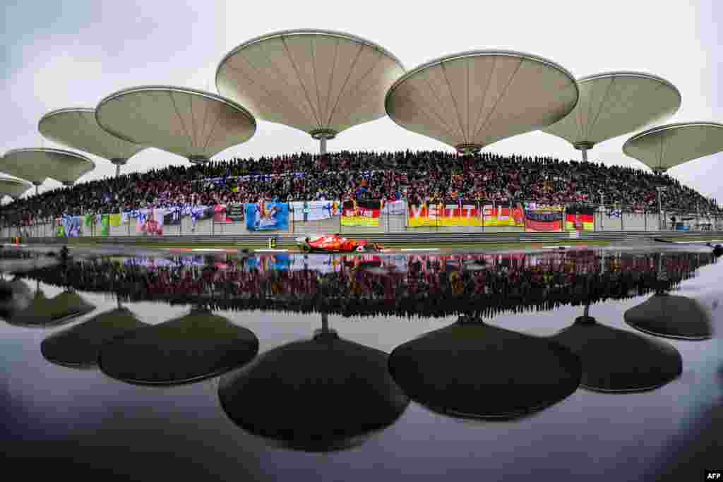 Ferrari&#39;s German driver Sebastian Vettel drives during the Formula One Chinese Grand Prix in Shanghai.