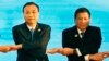 FILE - In this Sept. 7, 2016, photo, Chinese Premier Li Keqiang (L) and Philippine President Rodrigo Duterte link arms during the ASEAN Plus Three summit in Vientiane, Laos. After lashing out at longtime ally America, Duterte is making a state visit to Ch