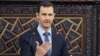 In this photo released by the Syrian official news agency SANA, shows Syrian President Bashar Assad, as he delivers a speech at the parliament in Damascus, June 3, 2012.