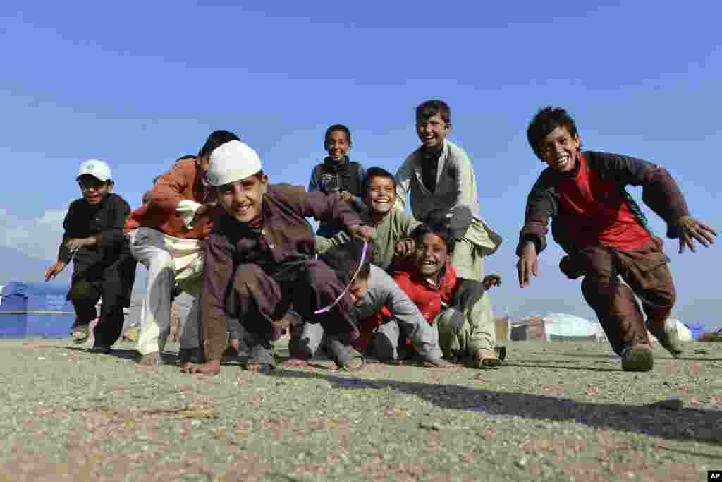Afghan children play on the outskirts of Jalalabad, capital of Nangarhar province, Dec. 13, 2016.