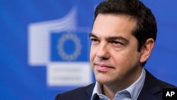 Greece's Prime Minister Alexis Tsipras addresses the media at the European Commission headquarters in Brussels, March 13, 2015. 