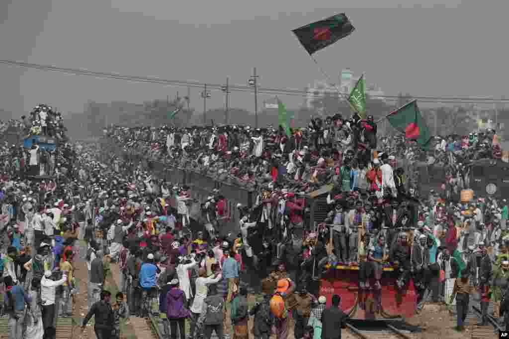 Bangladeshi Muslim devotees head to their homes in an over-crowded train after attending the final day of a three-day Islamic congregation on the banks of the River Turag in Tongi, about 20 kilometers (13 miles) north of the capital Dhaka, Bangladesh.