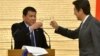 FILE - Philippines President Rodrigo Duterte (L) toasts with Japan Prime Minister Shinzo Abe during a banquet at Abe's official residence in Tokyo, Oct. 26, 2016. 