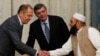 FILE - Russian Foreign Minister Sergei Lavrov welcomes member of Taliban delegation Alhaj Mohammad Sohail Shaina during earlier talks, Nov. 9, 2018. Russian officials have confirmed that there will be no participation by the Taliban government at the 2022 talks.