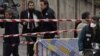 Police gather at the site of a shooting in Toulouse, southwestern France, Monday, March 19, 2012. 