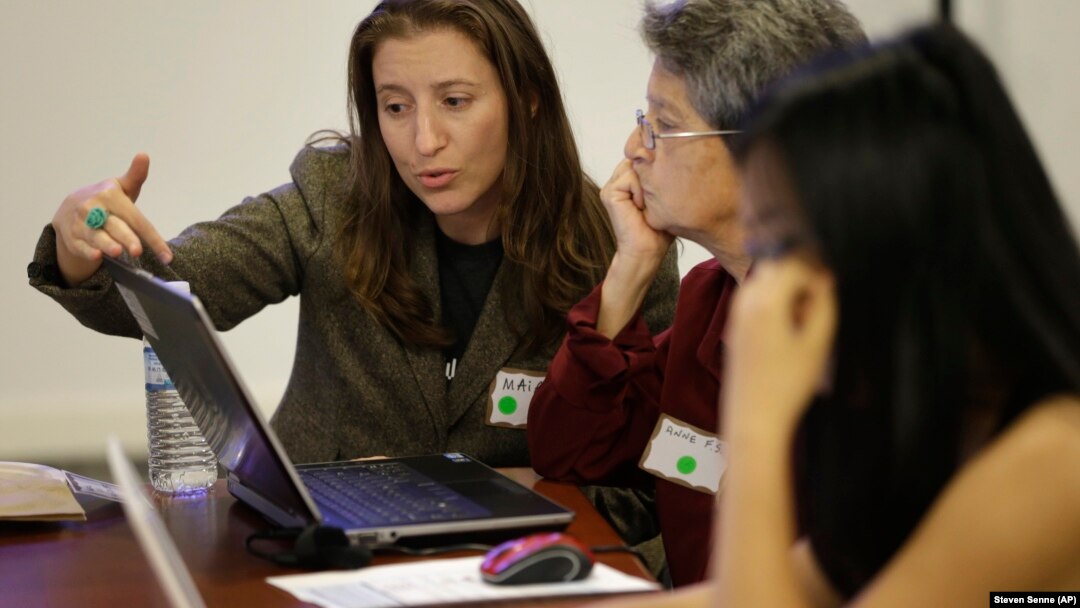 Brown University graduate Maia Weinstock, left, works with Anne Fausto-Sterling, of Cranston, R.I., center, a professor of biology and gender studies on the Brown campus in Providence, Rhode Island.