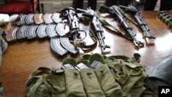  Some of the arms and ammunition recovered by police displayed in Nairobi, Kenya, September 14, 2012. 