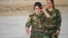 Young female fighters say they they hope to battle Islamic State militants after mass rapes, executions and kidnappings that the United Nations says amounts to genocide, Nov. 14, 2016, in Snuny, Iraq. (H. Murdock/VOA)