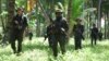 FILE - US Marines assigned to Fleet Anti-terrorism Security Team (FAST) Pacific and Philippine Marines conduct a patrol during an amphibious beach assault exercise for Cooperation Afloat Readiness and Training (CARAT) Philippines in 2012.