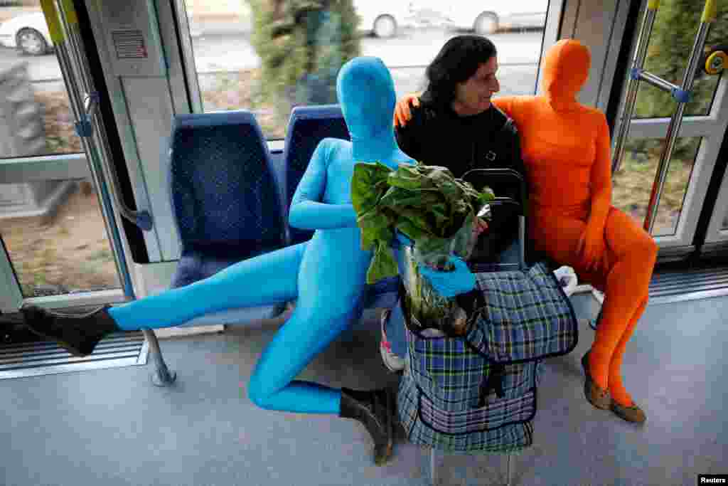 Members of the Prizma Ensemble wearing bodysuits take part in a festival for the Jewish holiday of Hanukkah, in Jerusalem.