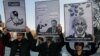 FILE - Members of the Turkish Youth Union hold cartoons depicting Turkey's PM Recep Tayyip Erdogan during a protest against a ban on Twitter, Ankara, March 21, 2014.