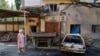 A woman walks at a site of a recent shelling, which local Russian-installed authorities called a Ukrainian military strike, in the course of Russia-Ukraine conflict in Donetsk, Russian-controlled Ukraine, July 22, 2024. 