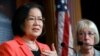 Sen. Mazie Hirono, D-Hawaii, left, holds back tears as she recalls images of drowned migrants, during a news conference on new legislation regarding detention of immigrants near the southern border, July 11, 2019, on Capitol Hill in Washington.