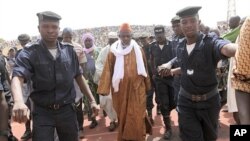 Iman Amadoun Diko (C), highly influential head of the High Council of Islam, arrives for a rally organized to calm the political situation down in Mali, at Modibo Keita stadium in Bamako, March 31, 2012.