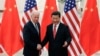 档案照：2013年12月4日，时任美国副总统拜登与中国国家主席习近平在北京人民大会堂握手。
