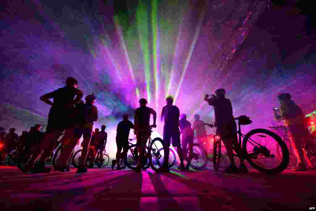 Mountainbikers take part in an event tour through the "Erlebnis Bergwerk Merkers" disused salt mine in Merkers, central Germany, Dec. 11, 2016.