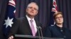 Australian Prime Minister Scott Morrison, left, speaks to the media alongside Foreign Minister Marise Payne during a press conference at the Parliament House in Canberra, Oct. 16, 2018.