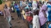 FILE - Refugees from Central Africa wait in Cameroonianian Garoua Boulaï border town for foods and clothes delivering by humanitarian associations. 