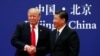 U.S. President Donald Trump and China's President Xi Jinping meet business leaders at the Great Hall of the People in Beijing, Nov. 9, 2017. 