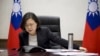 FILE - Taiwan's President Tsai Ing-wen speaks with U.S. President-elect Donald Trump through a speaker phone in Taipei, Taiwan. (Taiwan Presidential Office via AP)